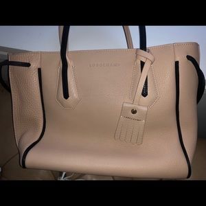 Genuine Longchamp Tassel drawstring leather tote.